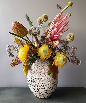 Colorful Floral Arrangement in Spotted Ceramic Vase