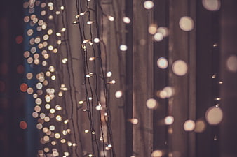 Warm Christmas String Lights Bokeh Against Dark Background