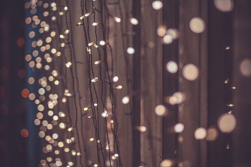 Warm Christmas String Lights Bokeh Against Dark Background