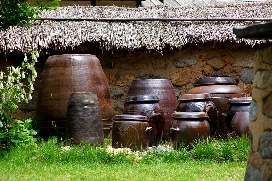 Traditional Korean earthenware pots in rustic garden