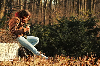 Woman Playing Flute in Autumn Forest