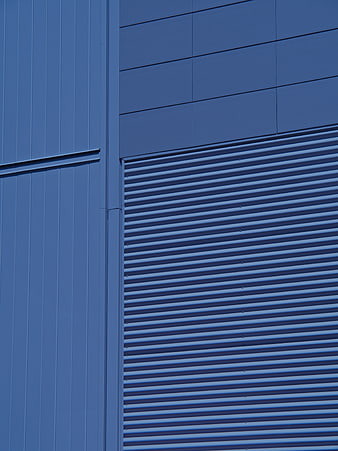 Abstract Blue Industrial Building Facade with Corrugated Metal