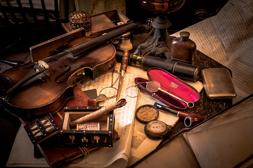Vintage Sherlock Holmes detective props and antique violin still life