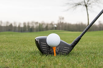 Golf driver and ball on tee ready for drive