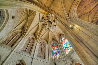 Gothic Cathedral Interior with Stained Glass Windows and Vaulted Ceiling