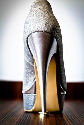 Silver Glitter High Heel Shoe Detail on Wooden Surface