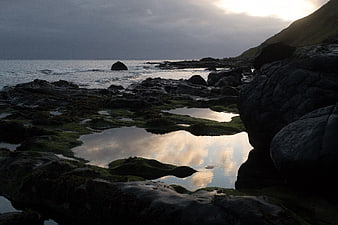 Dramatic Rocky Coastline with Tide Pools at Sunset
