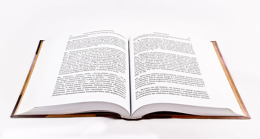Open Book with Russian Text on White Background