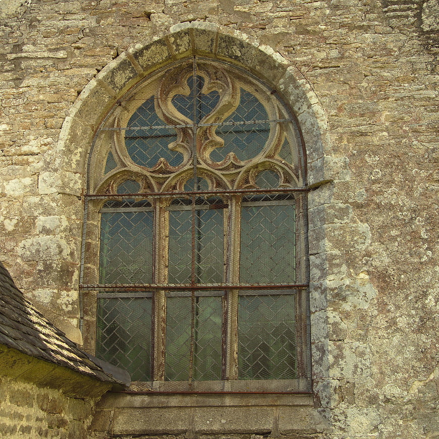 Gothic stone window on old church wall