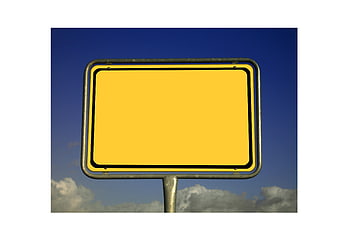 Empty Yellow Road Sign Mockup Against Blue Sky And Clouds