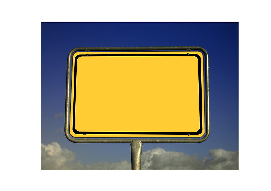 Empty Yellow Road Sign Mockup Against Blue Sky And Clouds