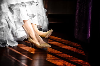 Bride's Gold Glitter Heels on Wooden Floor