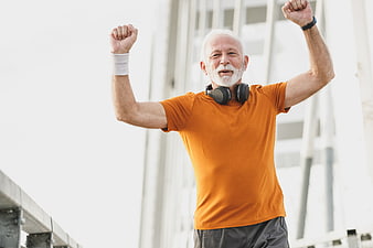 Happy Senior Man Celebrating Fitness Success Outdoors