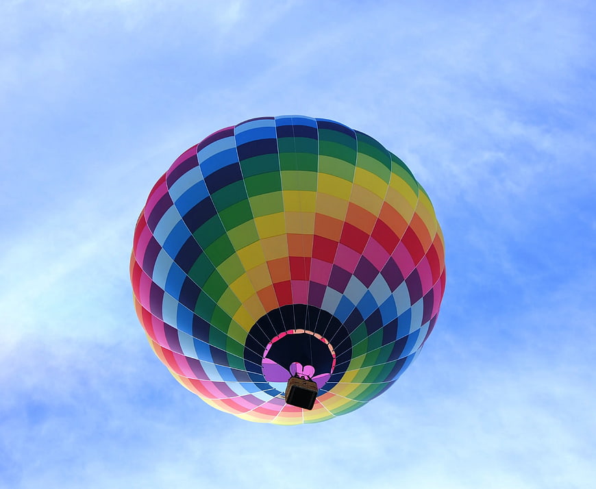 Colorful Hot Air Balloon Flying in Blue Sky