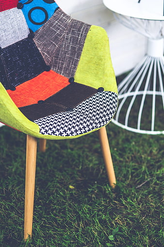 Colorful Patchwork Chair on Green Grass