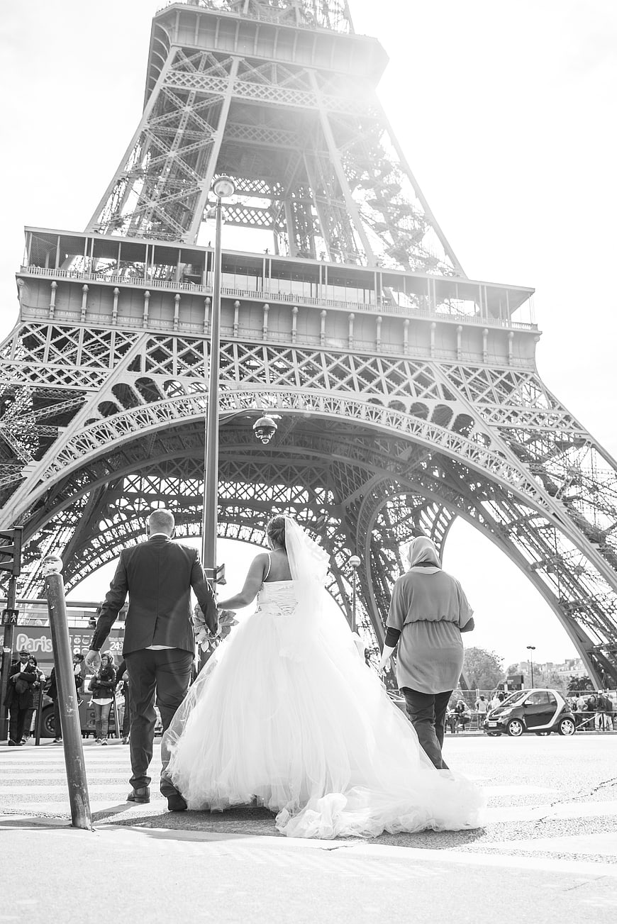 Bride and Groom Walking Under Eiffel Tower in Paris