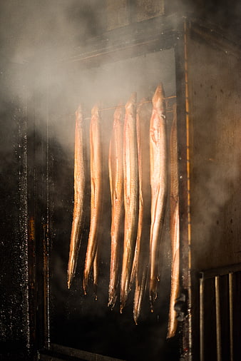 Smoked Eels Hanging in Traditional Smoker