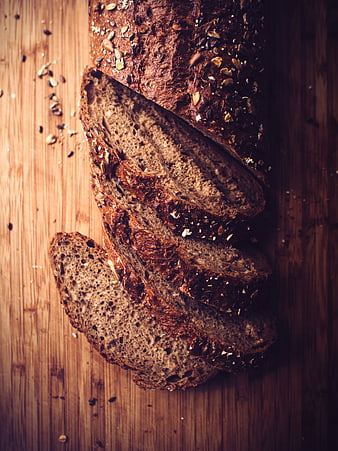 Sliced Whole Grain Bread on Wooden Board