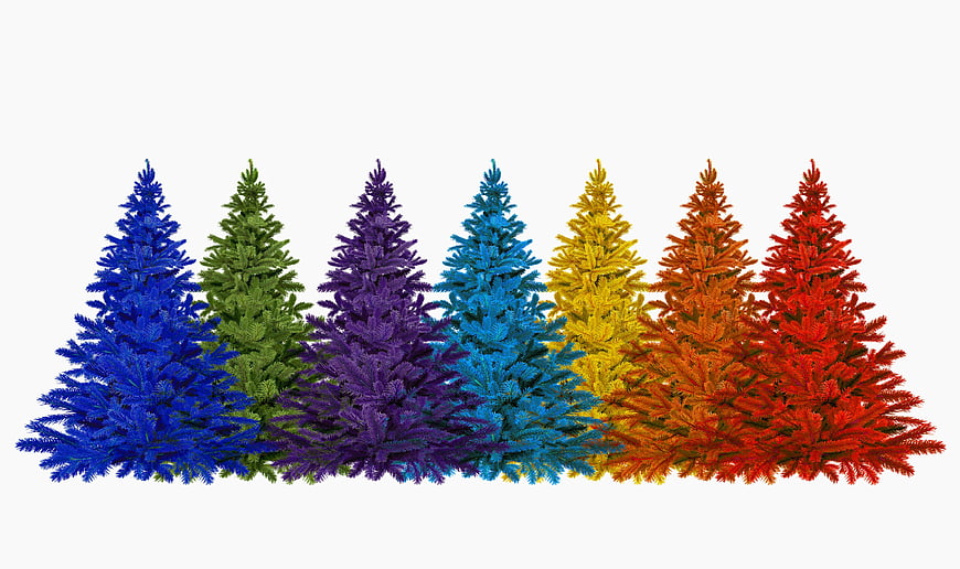Row of Multicolored Artificial Christmas Trees on White Background