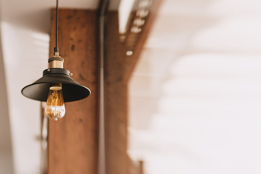 Vintage industrial pendant lamp with Edison bulb and copyspace