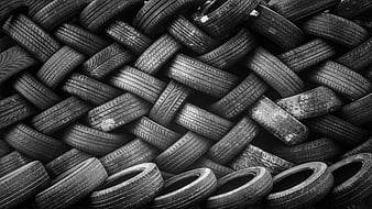 Black and white texture of stacked used tires