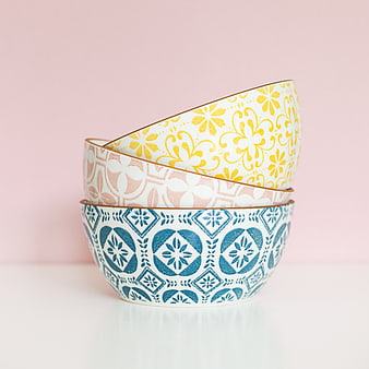 Stacked Patterned Ceramic Bowls on Pink Background