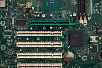 Close-up of vintage green computer motherboard with PCI slots