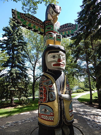 Painted Indigenous Totem Pole Sculpture in Park