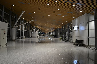 Empty Modern Airport Terminal Interior With Polished Floor And Wood Ceiling
