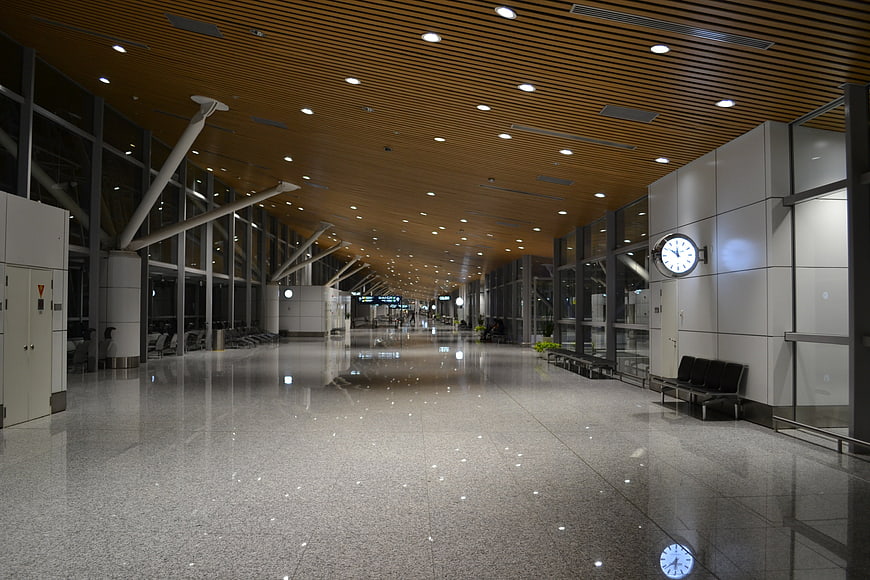 Empty Modern Airport Terminal Interior With Polished Floor And Wood Ceiling