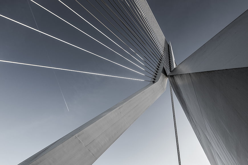 Low angle view of modern cable-stayed bridge architecture against sky