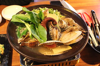 Traditional Korean Seafood Soup With Octopus, Shrimp, And Greens