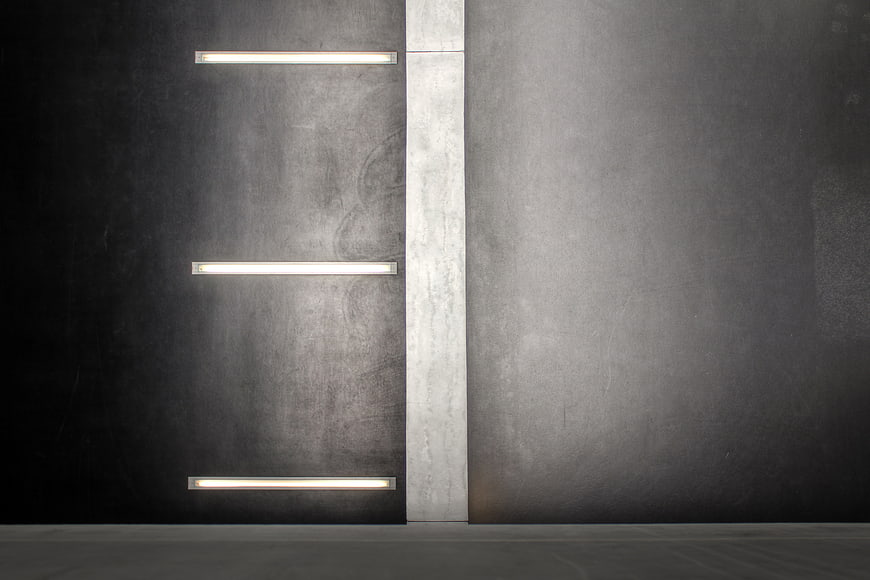 Minimalist concrete wall with horizontal fluorescent lights