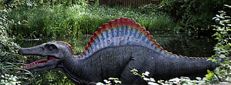 Spinosaurus Dinosaur Model In Lush Garden Setting