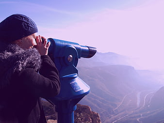 Woman Looking Through Blue Binoculars at Mountain View