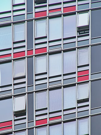 Modern Building Facade with Red and Gray Window Grid