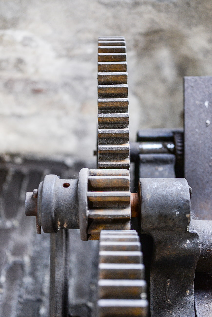 Close-up of rusty industrial gears and mechanical machinery