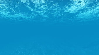 Underwater View of Blue Ocean Surface with Light Rays