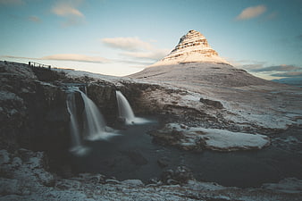 Kirkjufell Mountain and Waterfall in Winter Snow Landscape