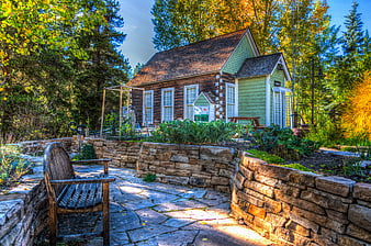 Rustic Log Cabin Garden With Stone Walls And Wooden Bench