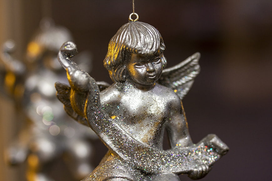 Close-up of Silver Glitter Christmas Angel Ornament
