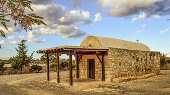 Old stone chapel with wooden porch in Cyprus