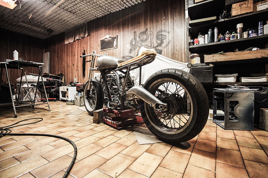 Custom Chopper Motorcycle in Rustic Workshop