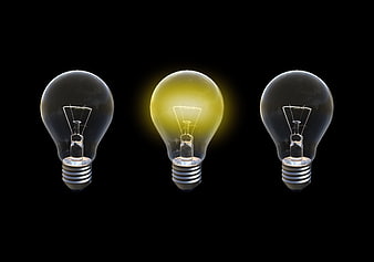 Three Light Bulbs With Center Illuminated On Black Background