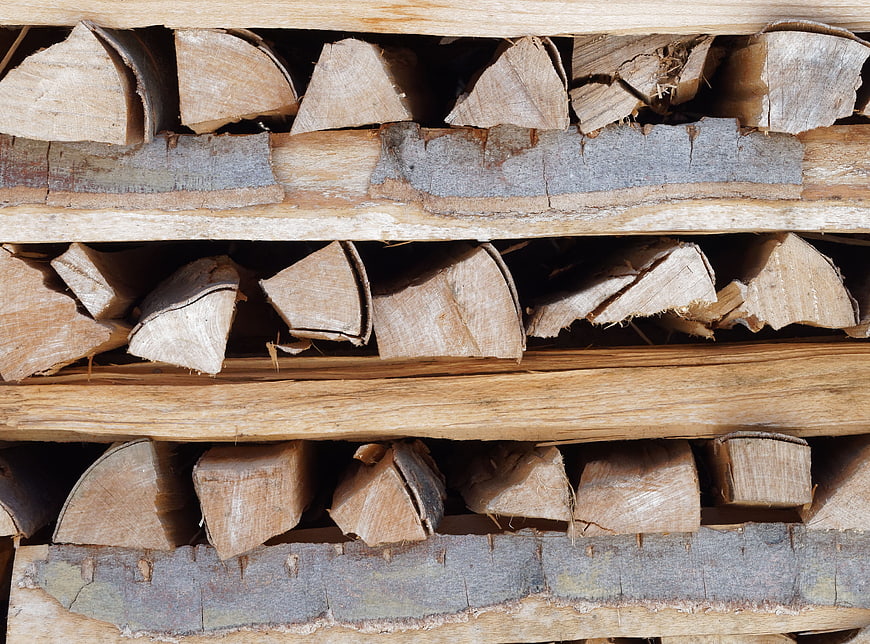 Stacked Firewood Logs Texture Background