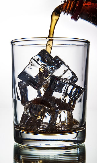 Refreshing Cola Pouring into Glass with Ice Cubes