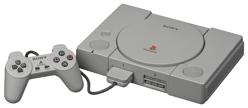 Original Sony PlayStation Console And Controller On White Background