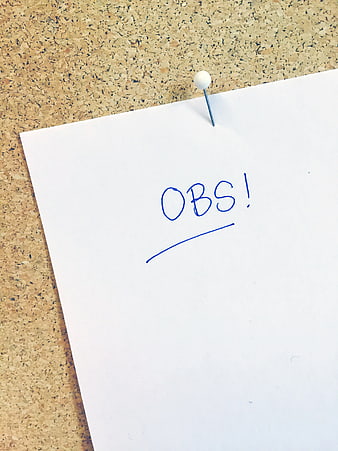 Handwritten OBS Note on Cork Board