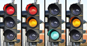 Sequence of traffic light signals showing red, amber, and green phases