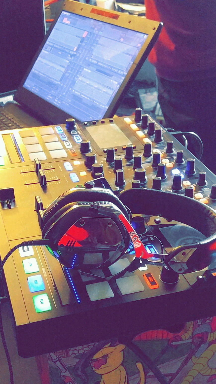 DJ Controller with Headphones and Laptop in Music Studio